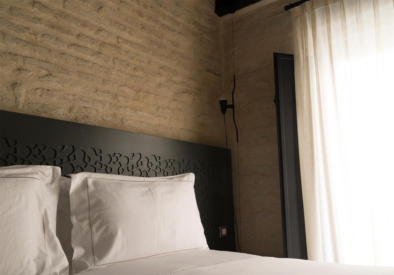 Eme Catedral Mercer Hotel Севилья Экстерьер фото A bedroom at the hotel